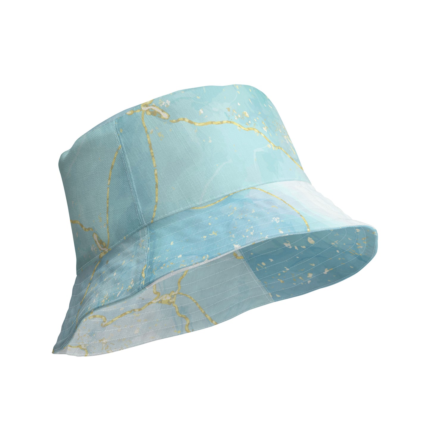 Angled underside view of the Living Waters reversible bucket hat showing the turquoise and gold pattern.