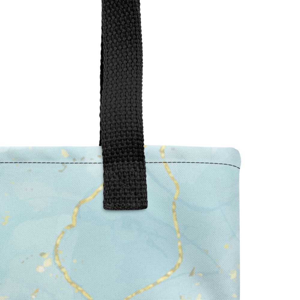 Close-up of the Living Waters tote bag showing the black handle and stitching.