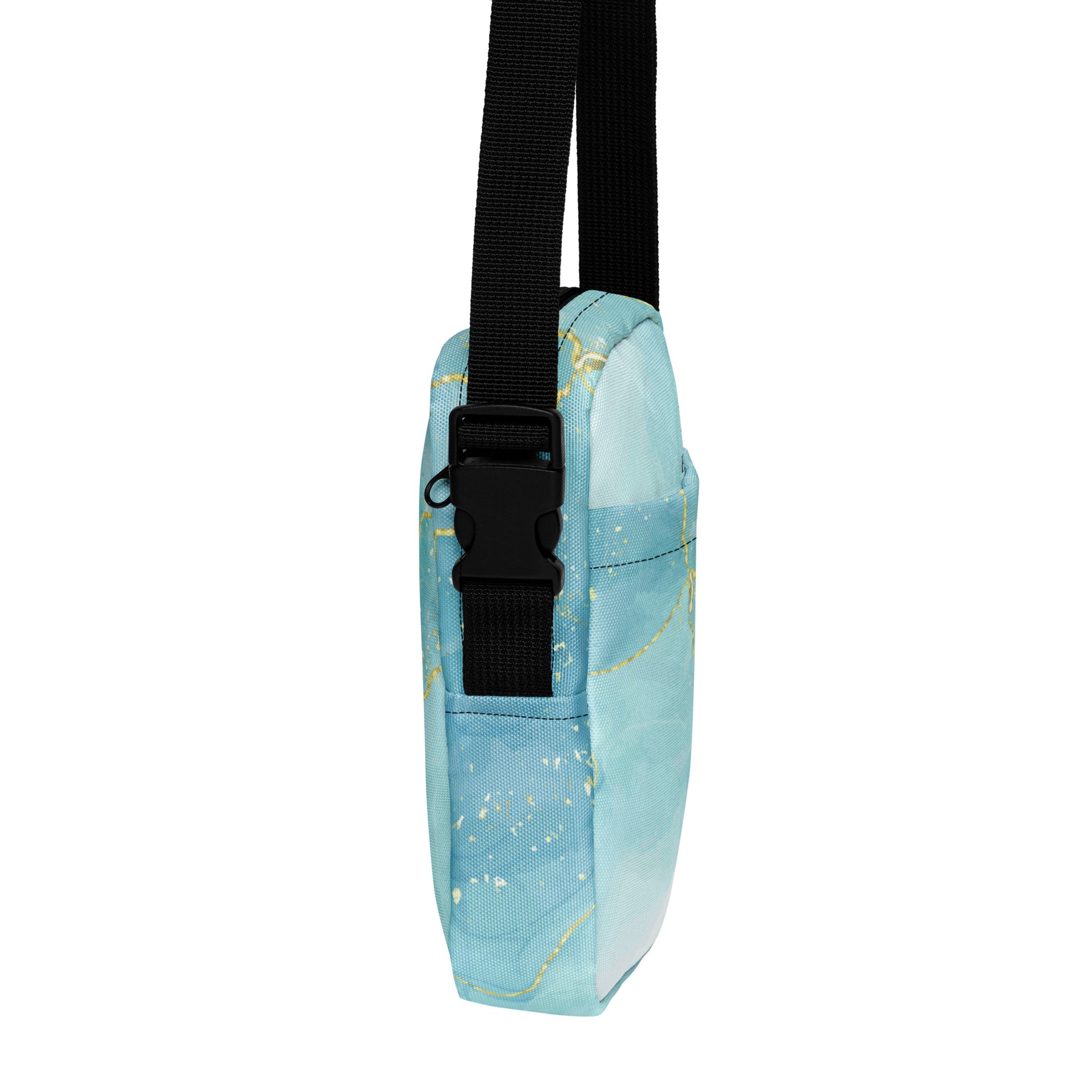Light blue pouch with gold speckles and a black strap on a white background